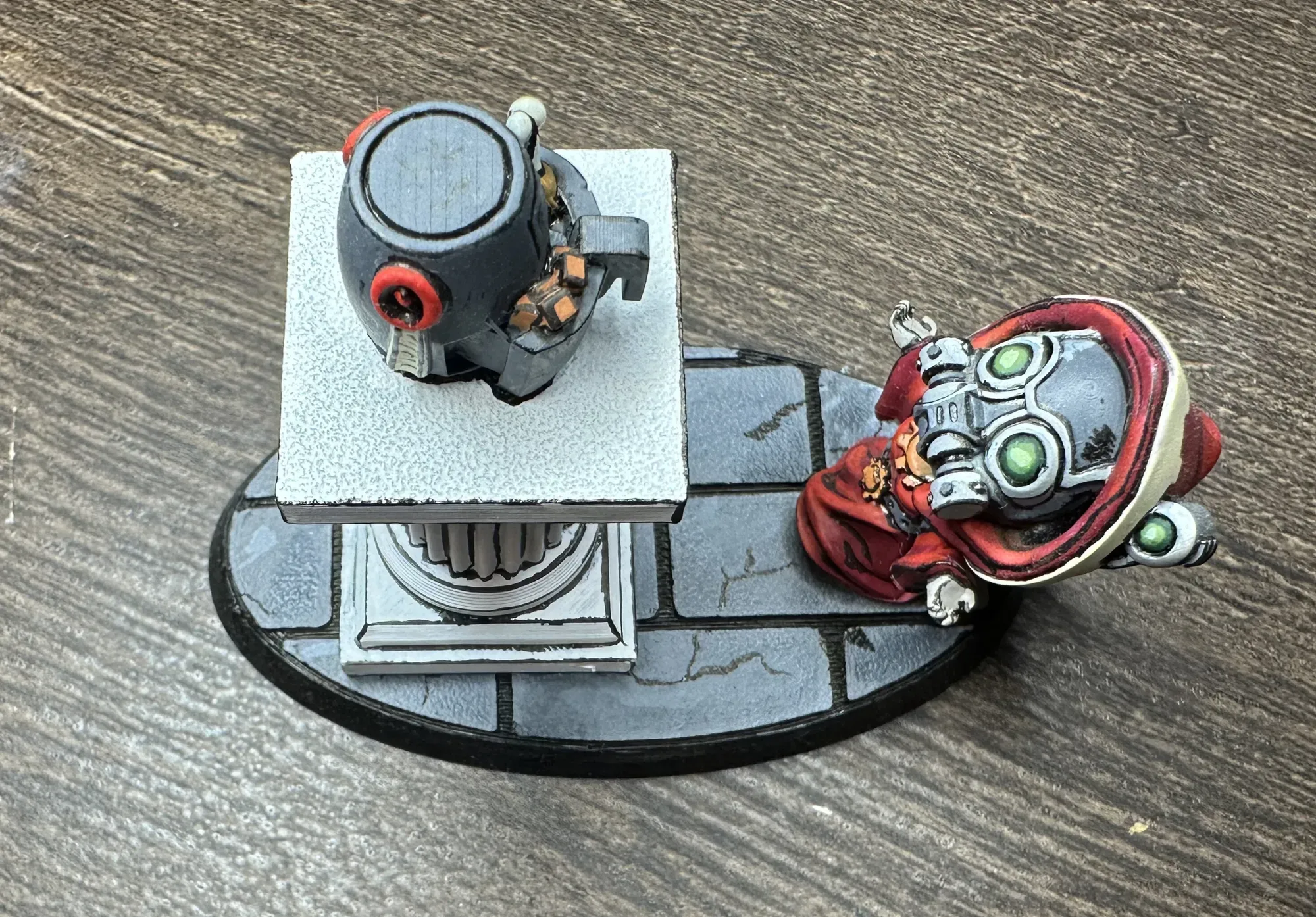 Top-down view of the chibi Admech tech-priest and air fryer scene showing stone base detail
