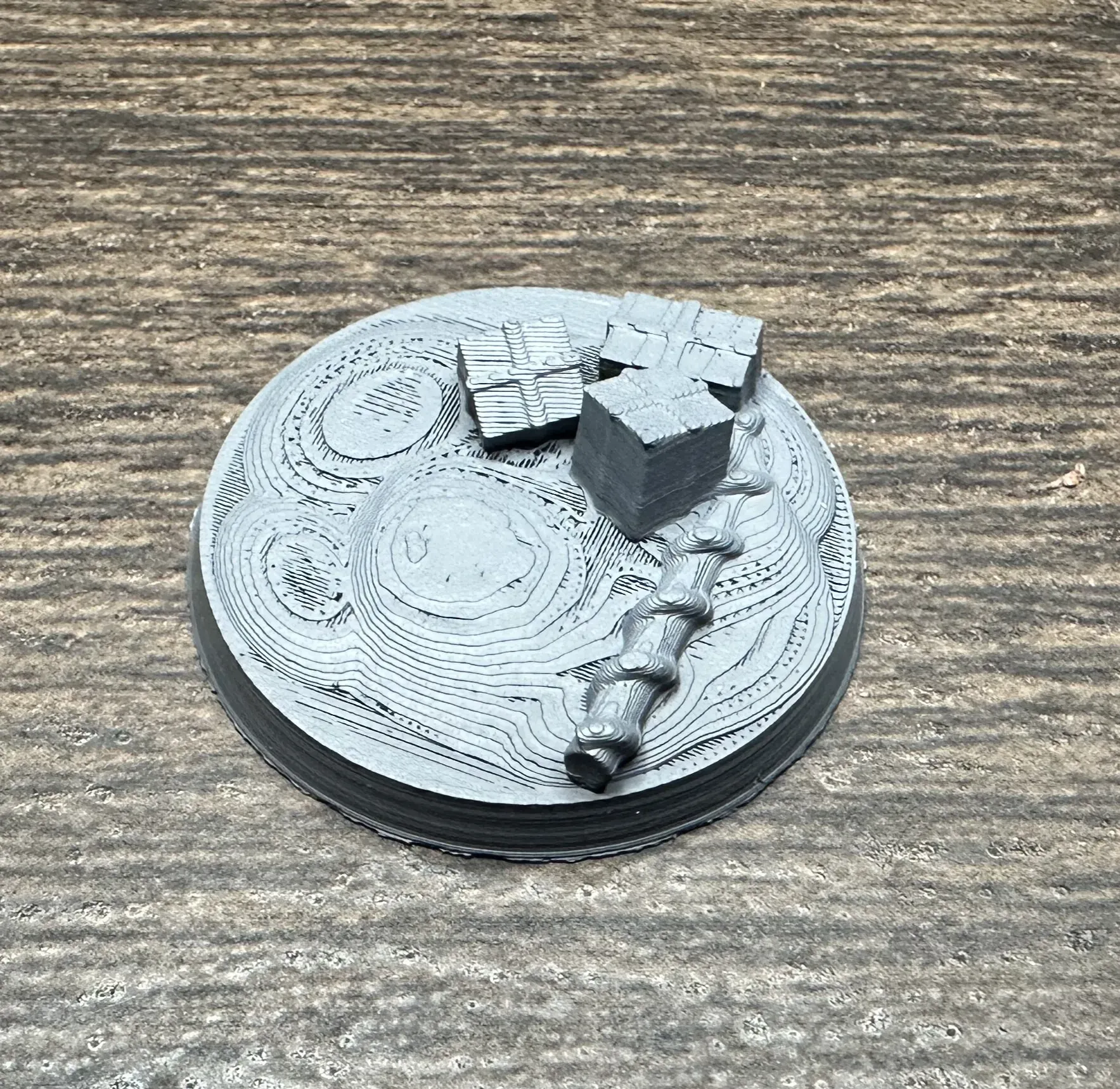 Christmas base with candy cane lying across wrapped presents