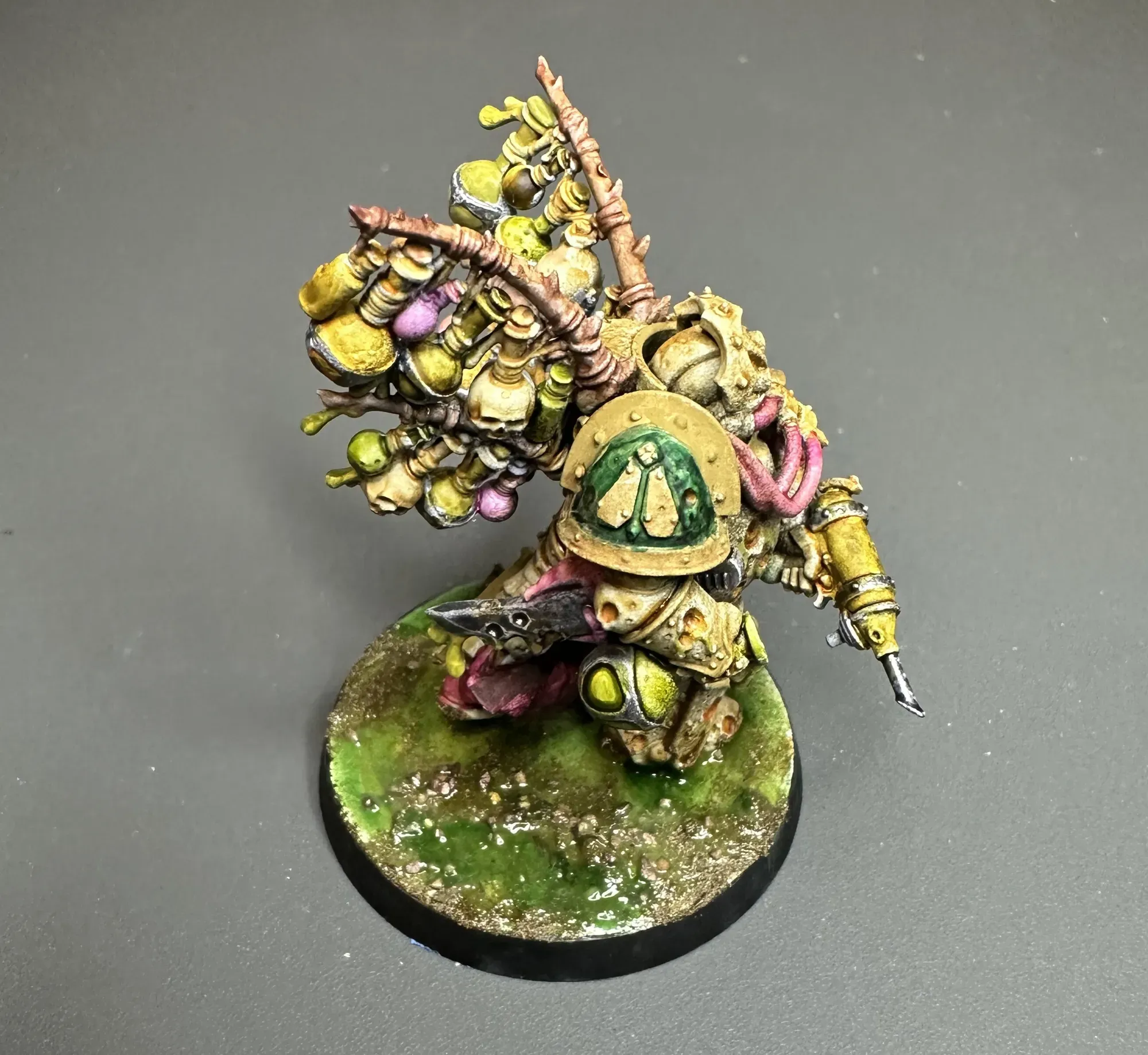Biologus Putrifier on toxic wasteland base with green sludge puddles and dark earth