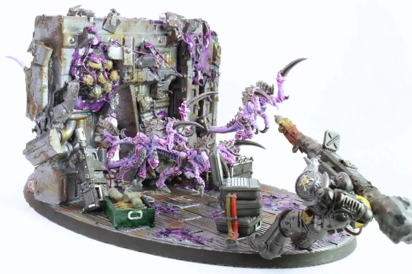 Rear angle of the diorama showing tyranids pouring over the bulkhead wall toward the defiant marine