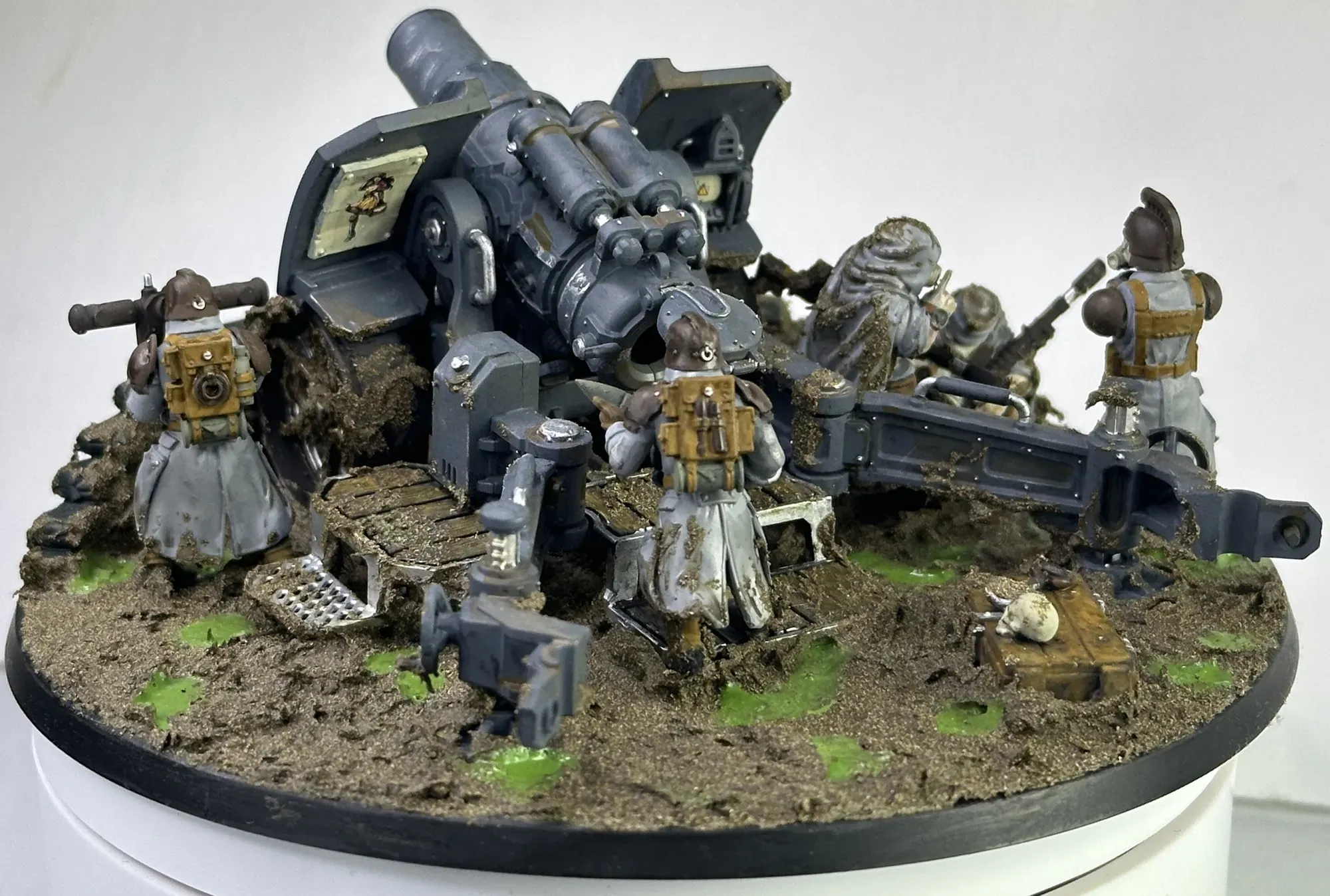 Back view of Krieg artillery crew showing soldiers at their posts and muddy terrain