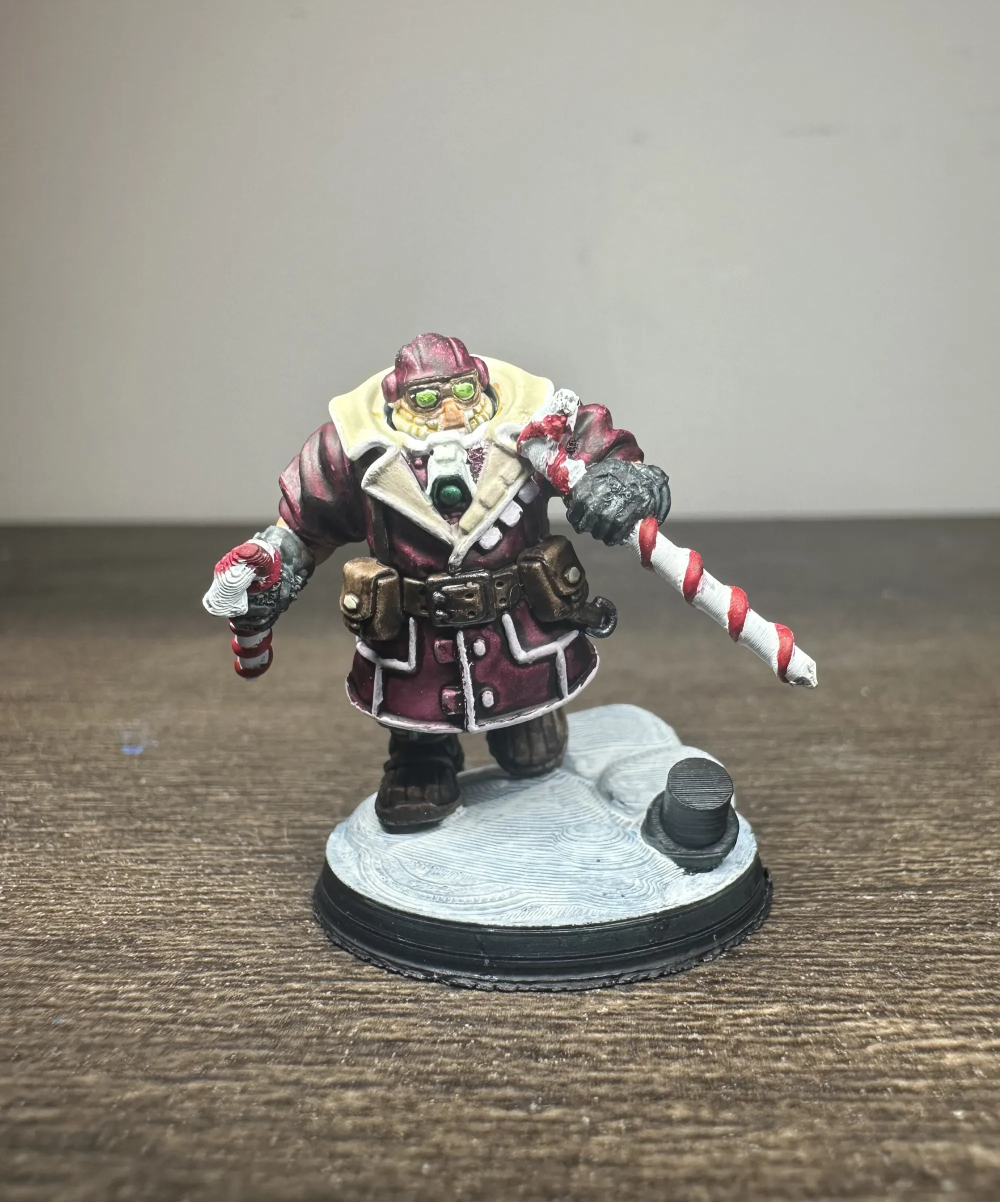 Kitbashed space dwarf dual wielding 3D printed candy canes on a melted snowman base
