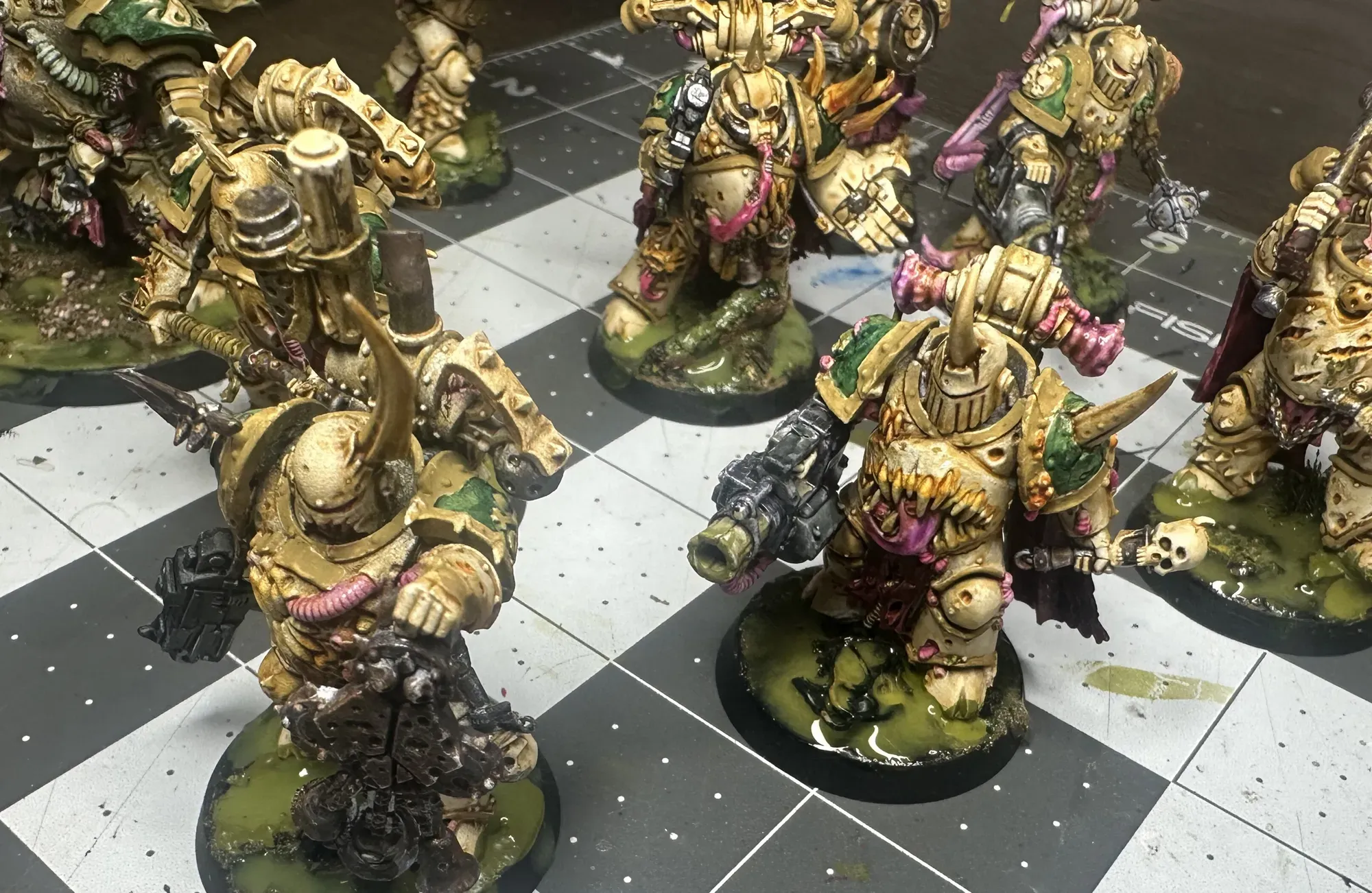 Full Death Guard squad showing updated toxic wasteland bases with layered green sludge