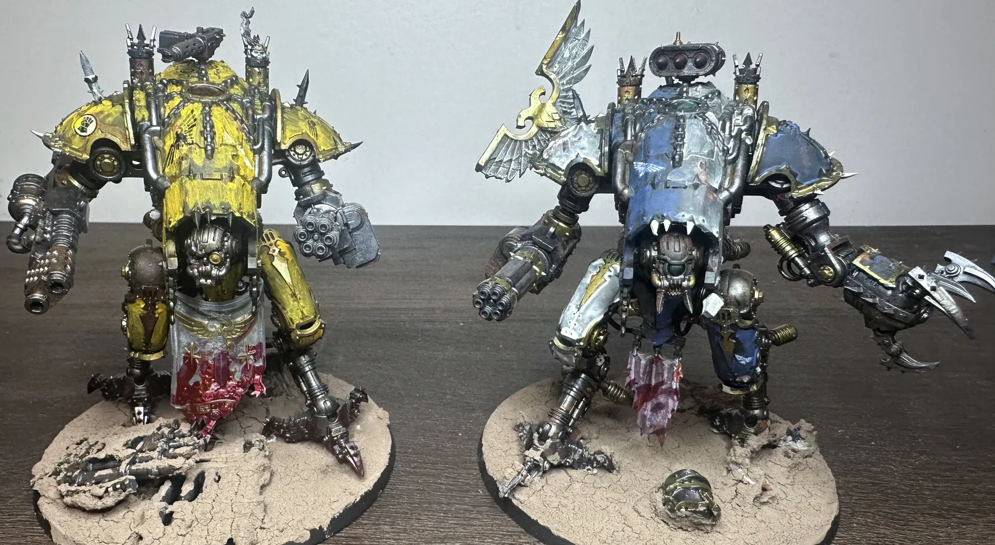 Two Chaos War Dogs painted in false Imperial colors